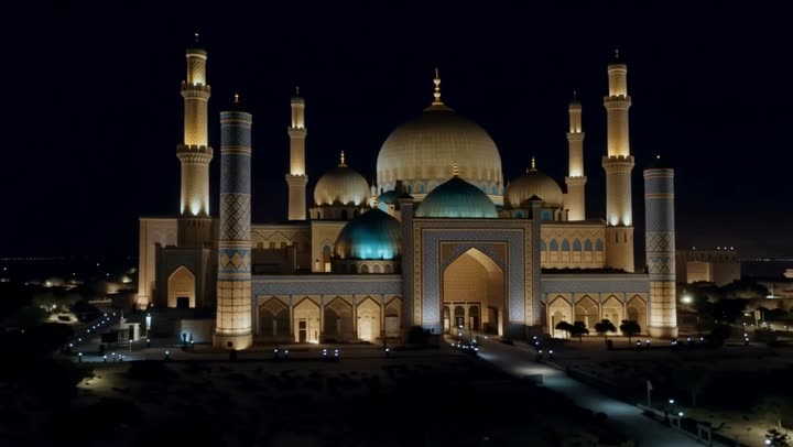 Illuminated mosque under night sky in Samarkand, Uzbekistan